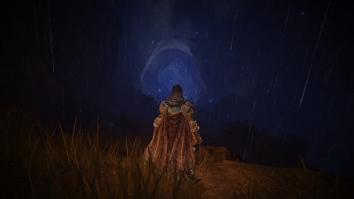 The player in Elden Ring: Shadow Of The Erdtree stands in front of a dark blue cave mouth tunnel.