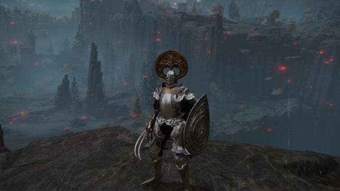 Elden Ring screenshot of the Tarnished on a cliff, wielding the Raptor Talons weapon.